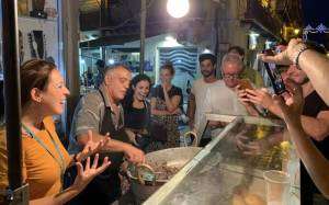 Group watching the preparation of pane ca meusa